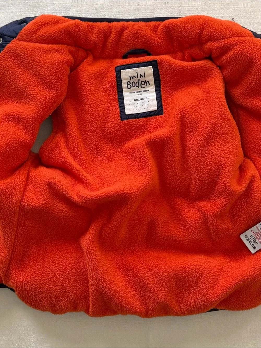 Mini Boden navy blue puffer vest with orange lining